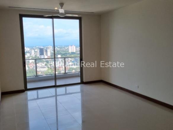 Gated modern house with paved entrance and side garden